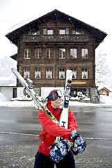 Woman carrying skis