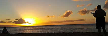 Ulelele player on the beach at sunset