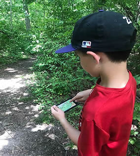 Boy with cell phone map