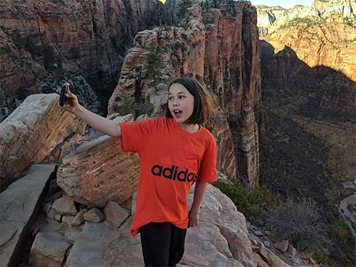 Erysse Elliott takes a selfie near the summit of Angel's Landing in Utah