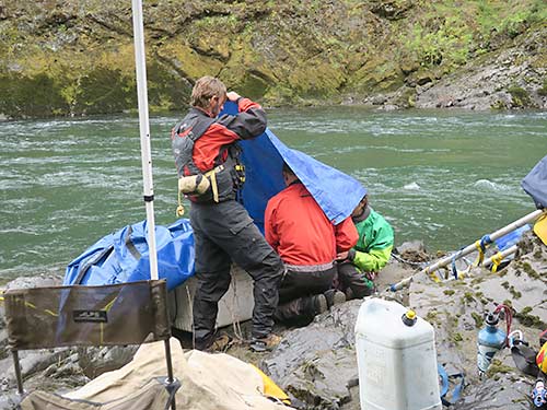 Illinois River rafting gluing the punctured raft