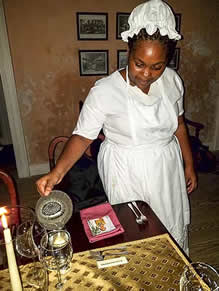 Barbados servent pours water