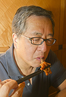 Richmond, BC man savoring chicken feet