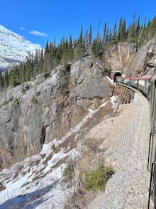 Skagway Railroad train approaches tunnel