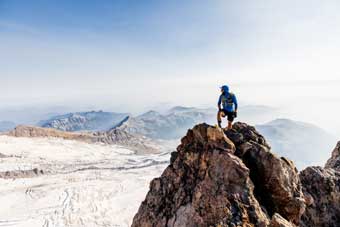 Jason Hardrath astride peak