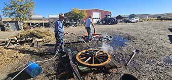 Mike Hanley seting a wagon wheel